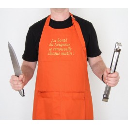 "Tablier : "La bonté du Seigneur se renouvelle chaque matin" couleur orange" taille unique "Tablier : "La bonté du Seigneur se renouvelle chaque matin" couleur orange" taille unique